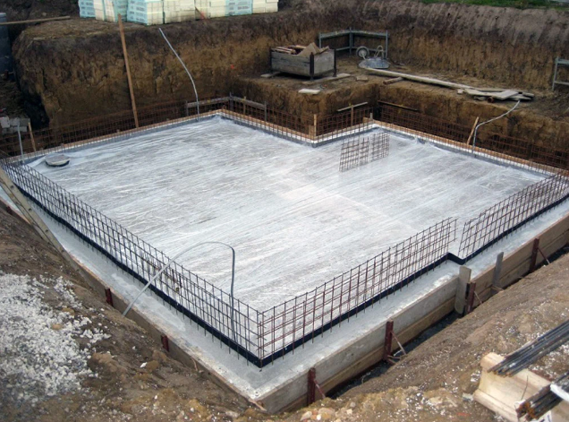 a large concrete slab in the middle of a construction site